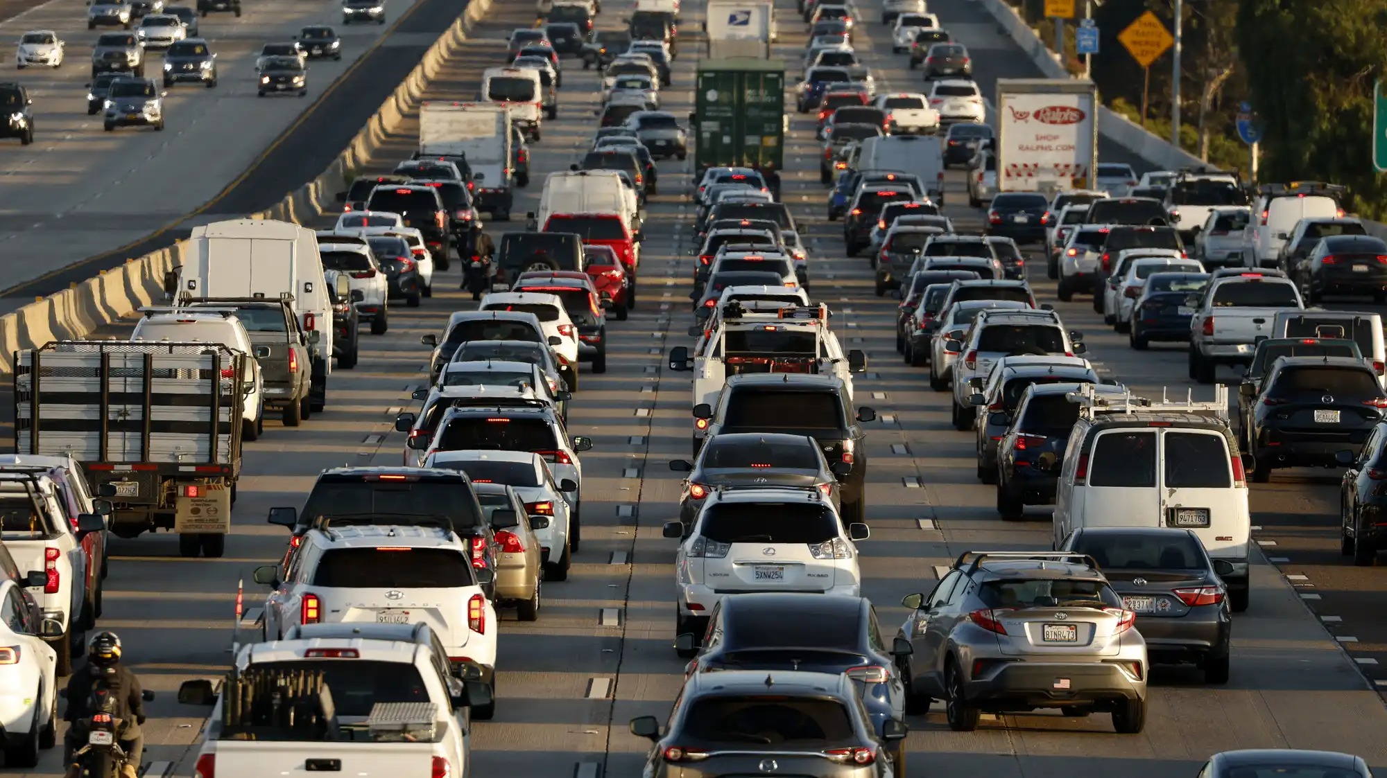 A view of cars in traffic from behind.