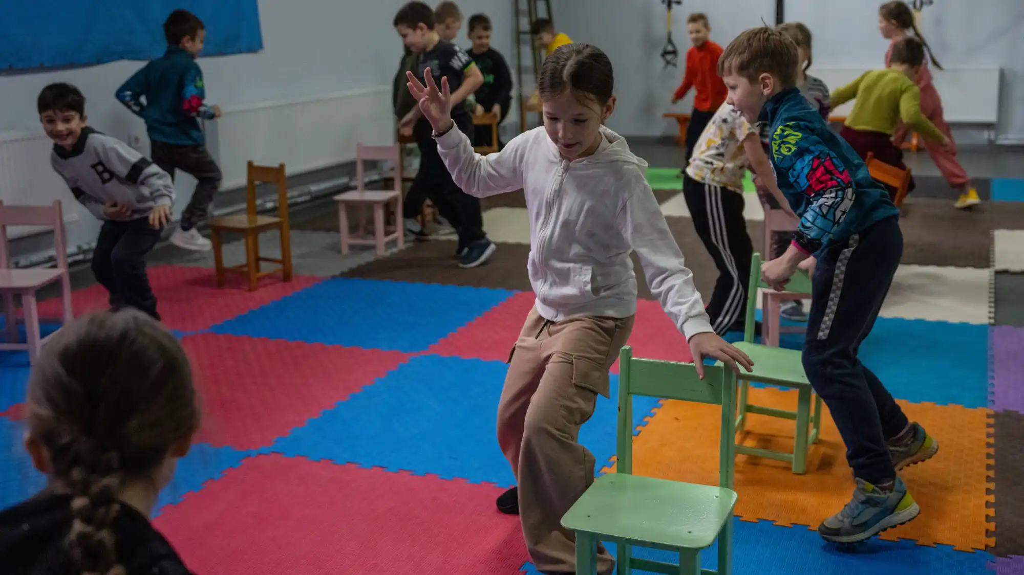 Children playing musical chairs