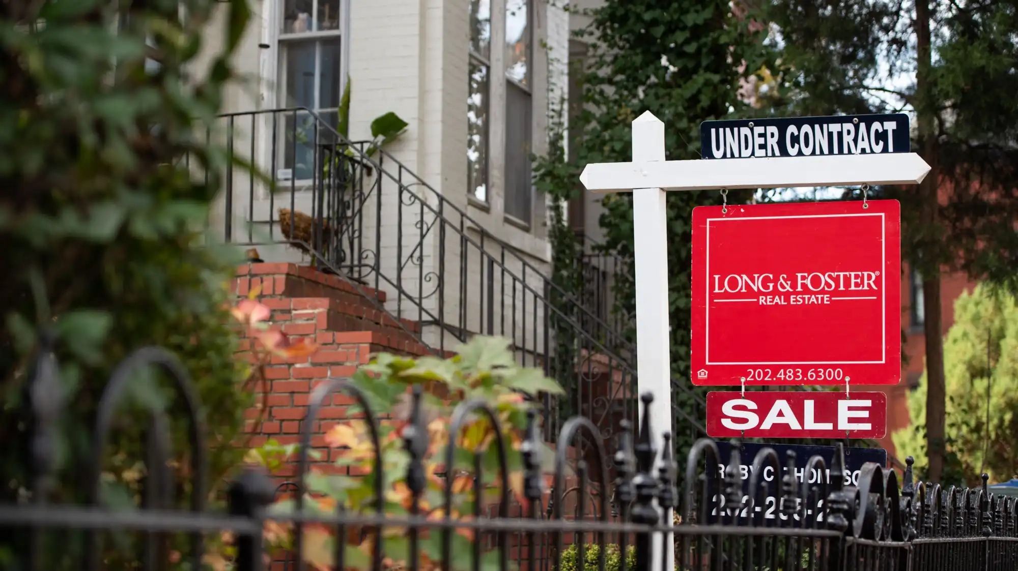 A home with a for sale sign