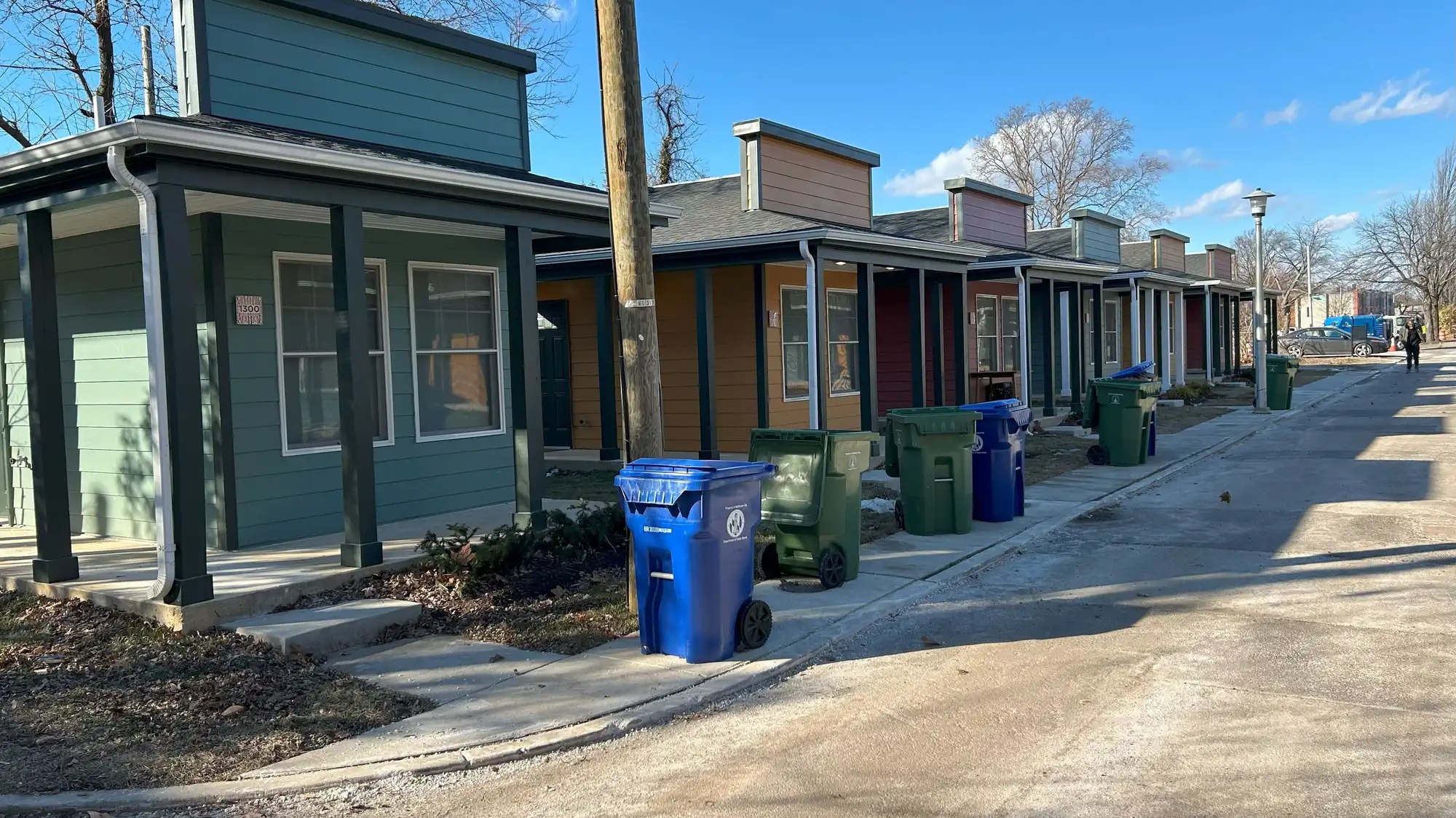 A row of tiny homes on a small street.