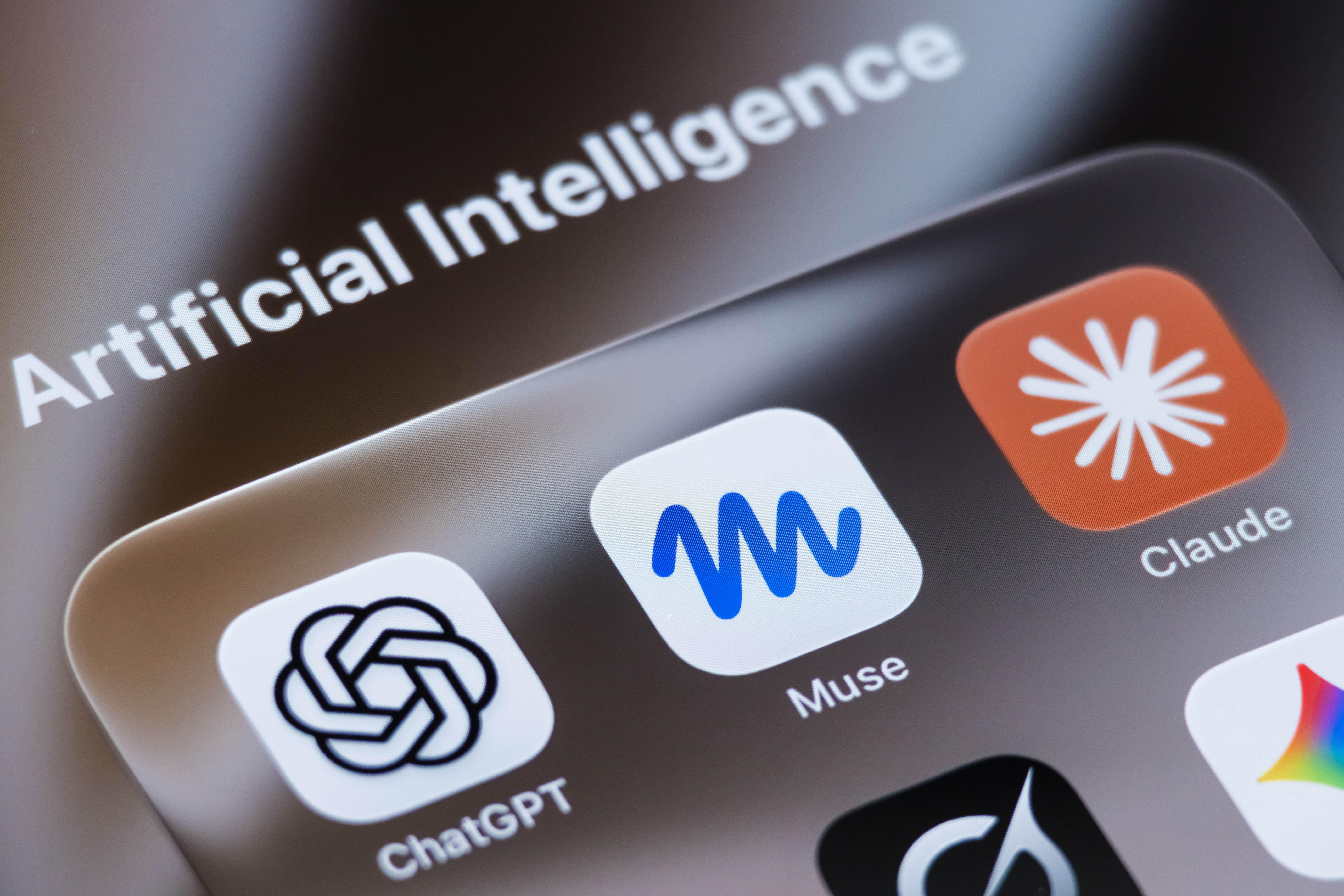 A photo illustration shows the app icons for ChatGPT, Muse and Claude on a phone screen.