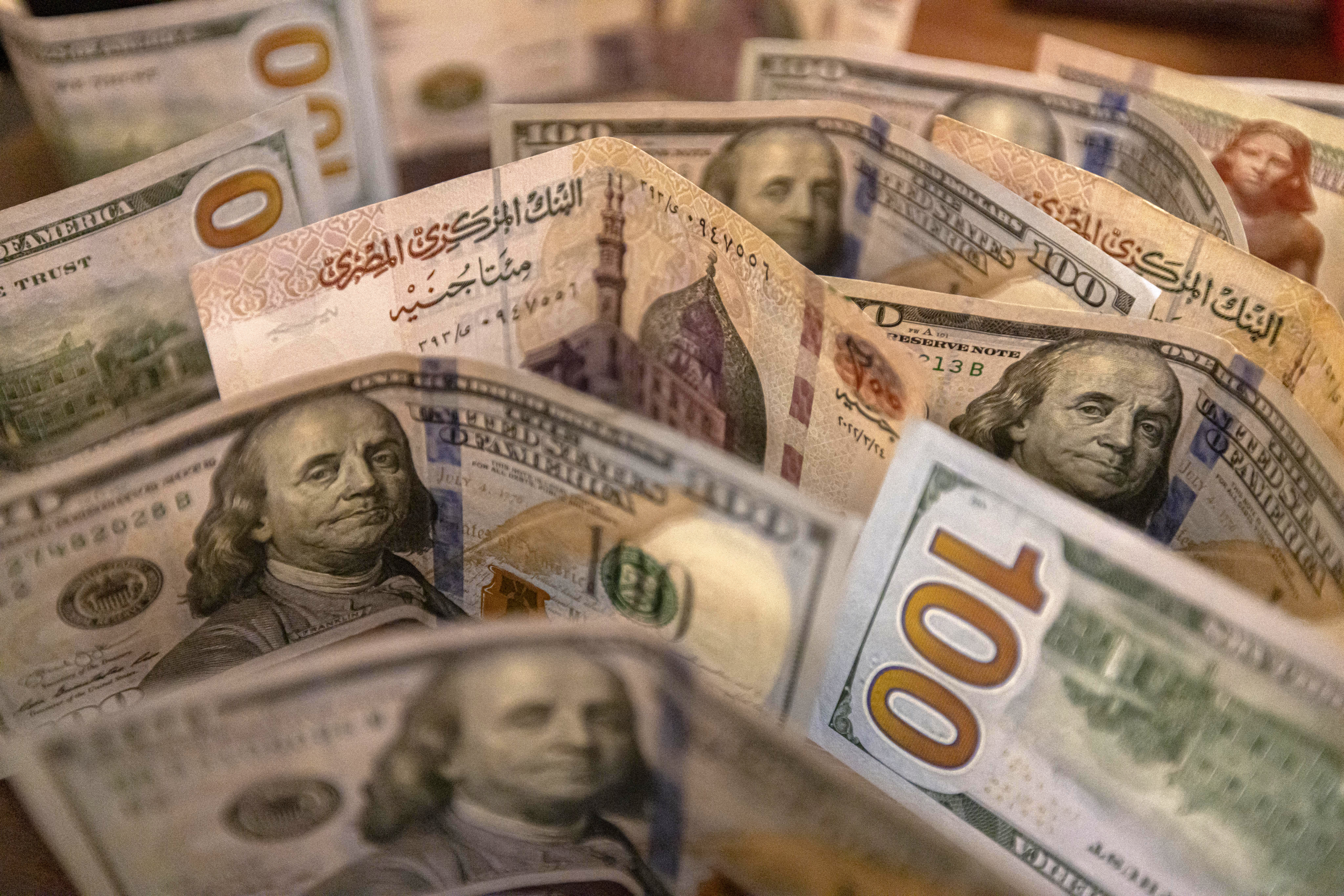 $100 bills mixed in with other foreign currency.