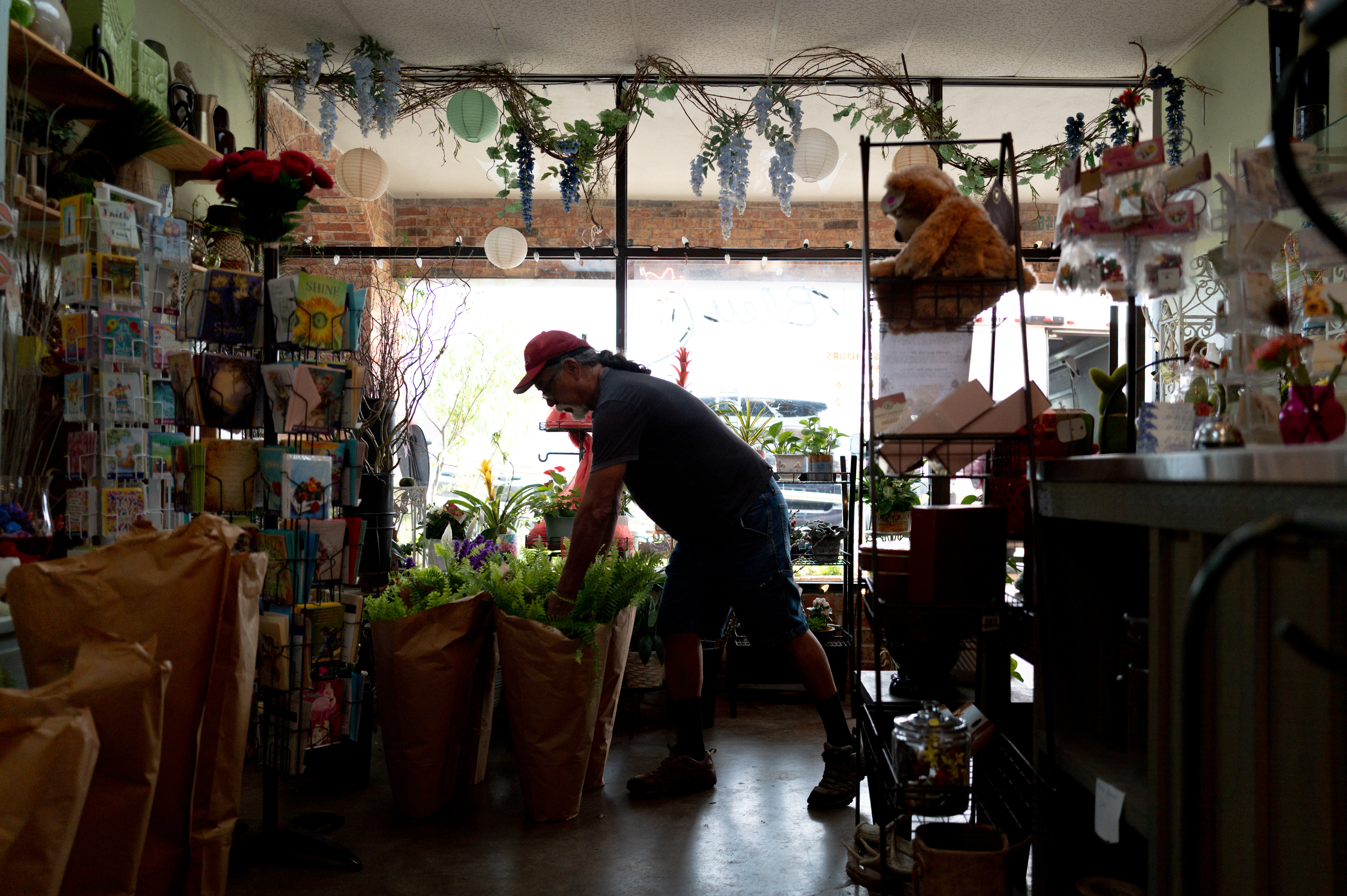 An employee at a flower shop.