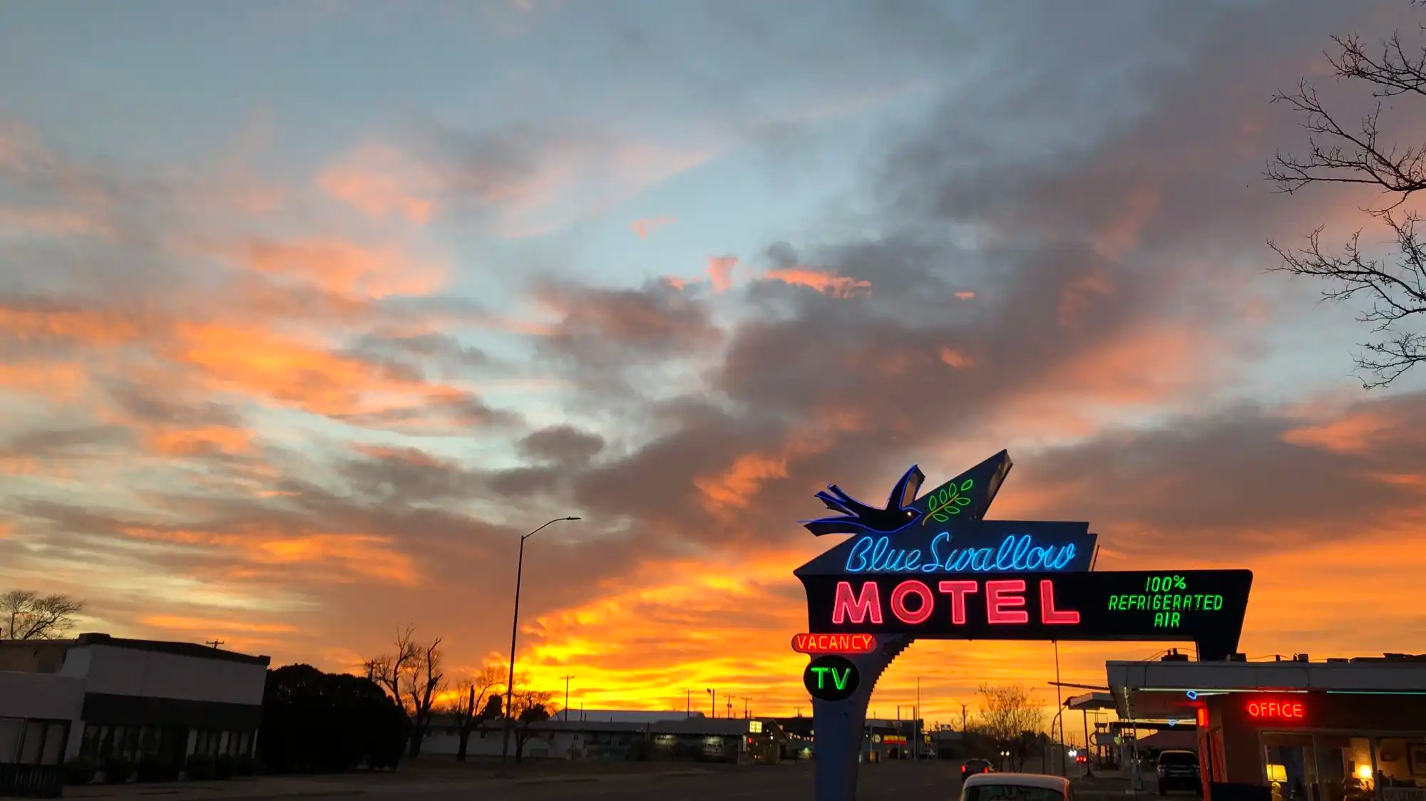 A view of the Blue Swallow Motel at dusk.