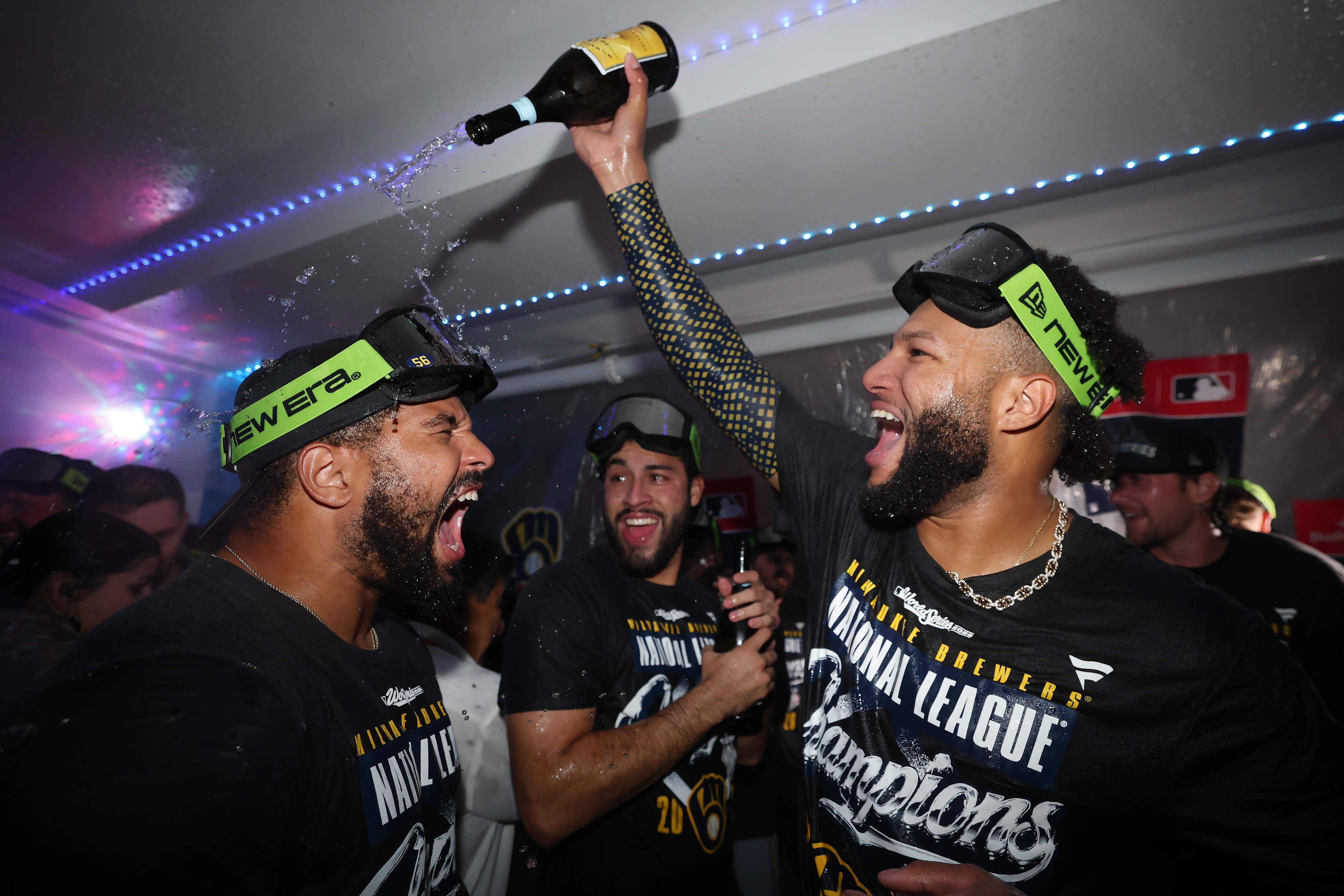 Brewers players celebrate in the locker room after the NLCS.