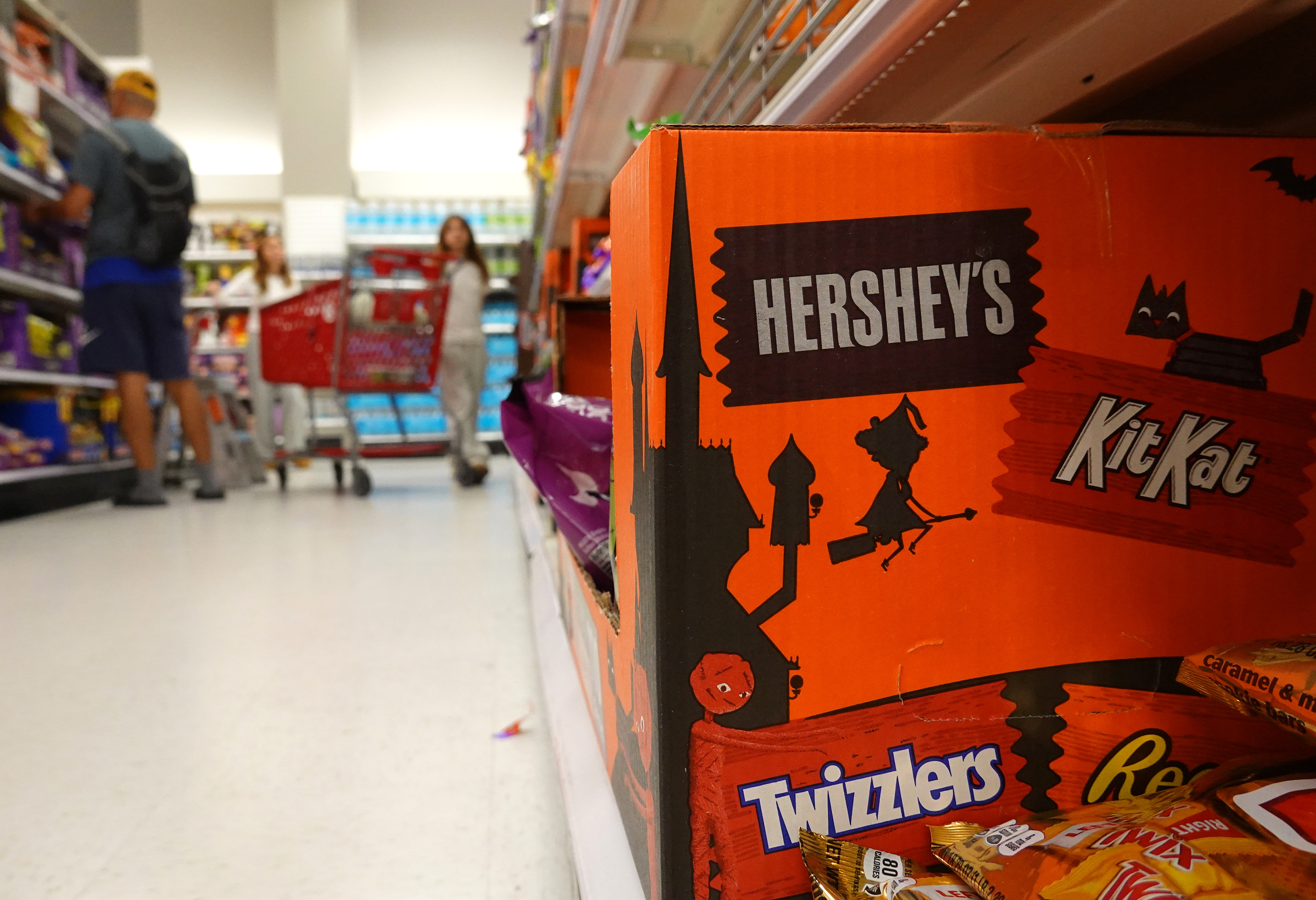Shoppers in the Halloween candy aisle at Target,