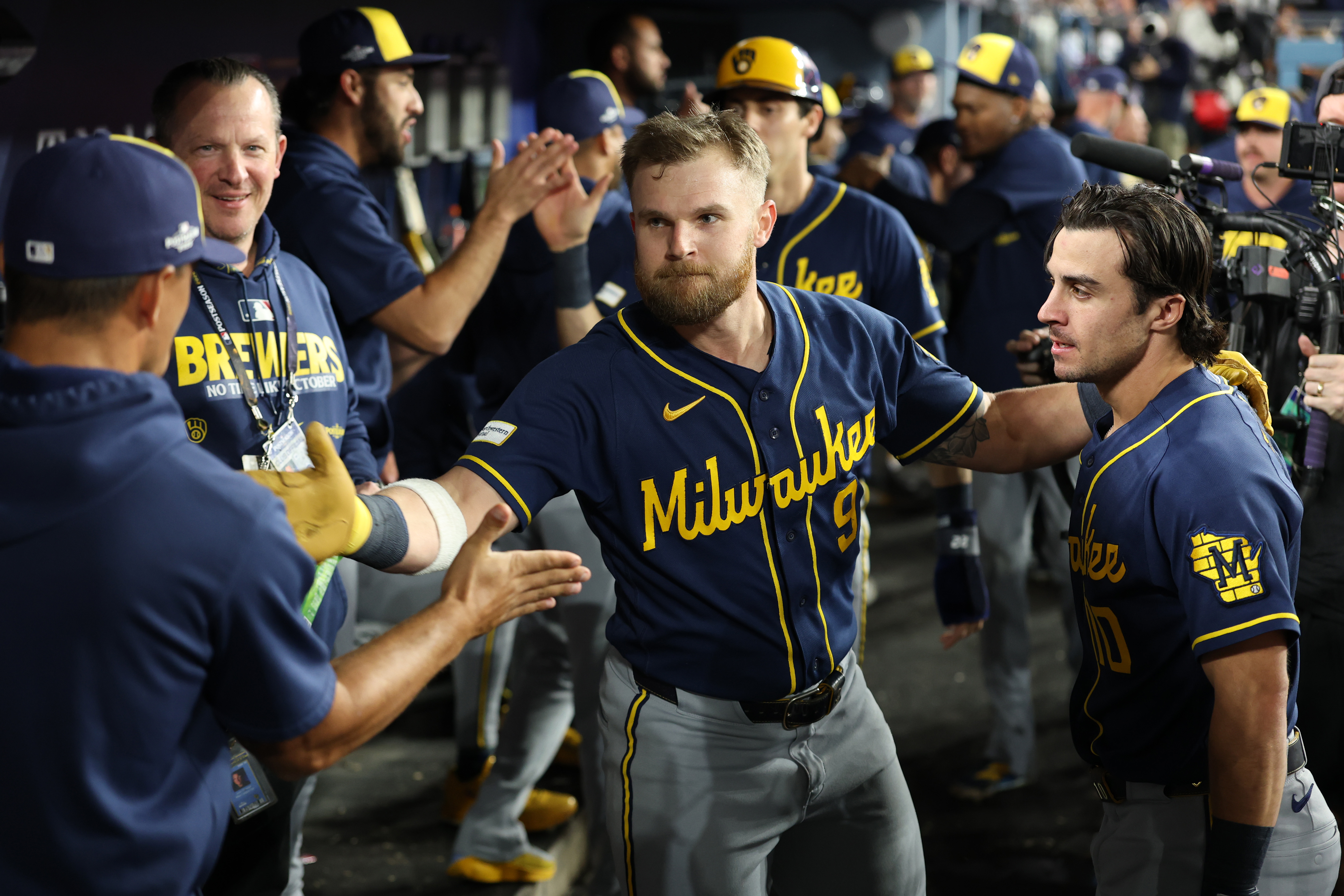 Jake Bauers walks through the Brewers dugout.