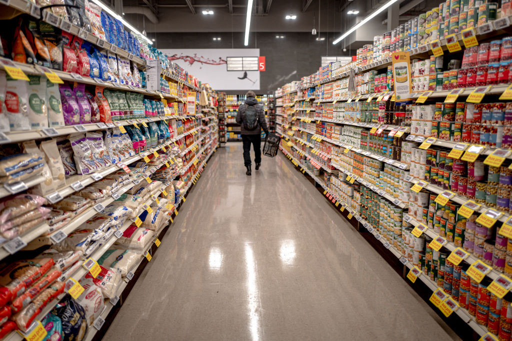 A man in a grocery aisle.