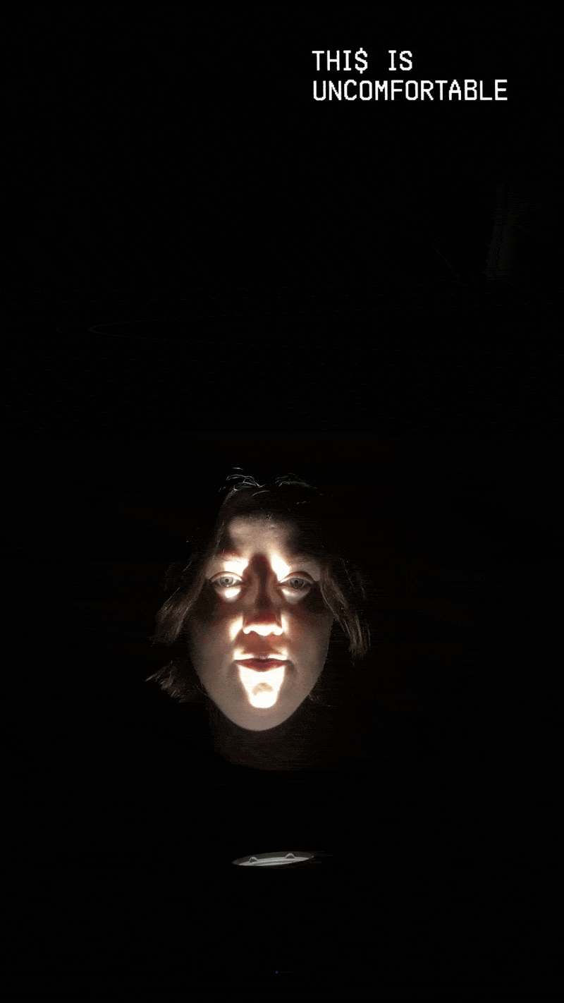 A woman with a flashlight shining up on her face tells a 