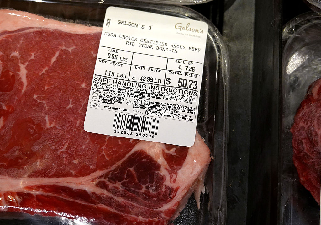 A package of steak at a grocery store has a $50 price tag.