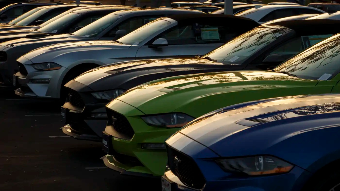 A line of cars at a lot.
