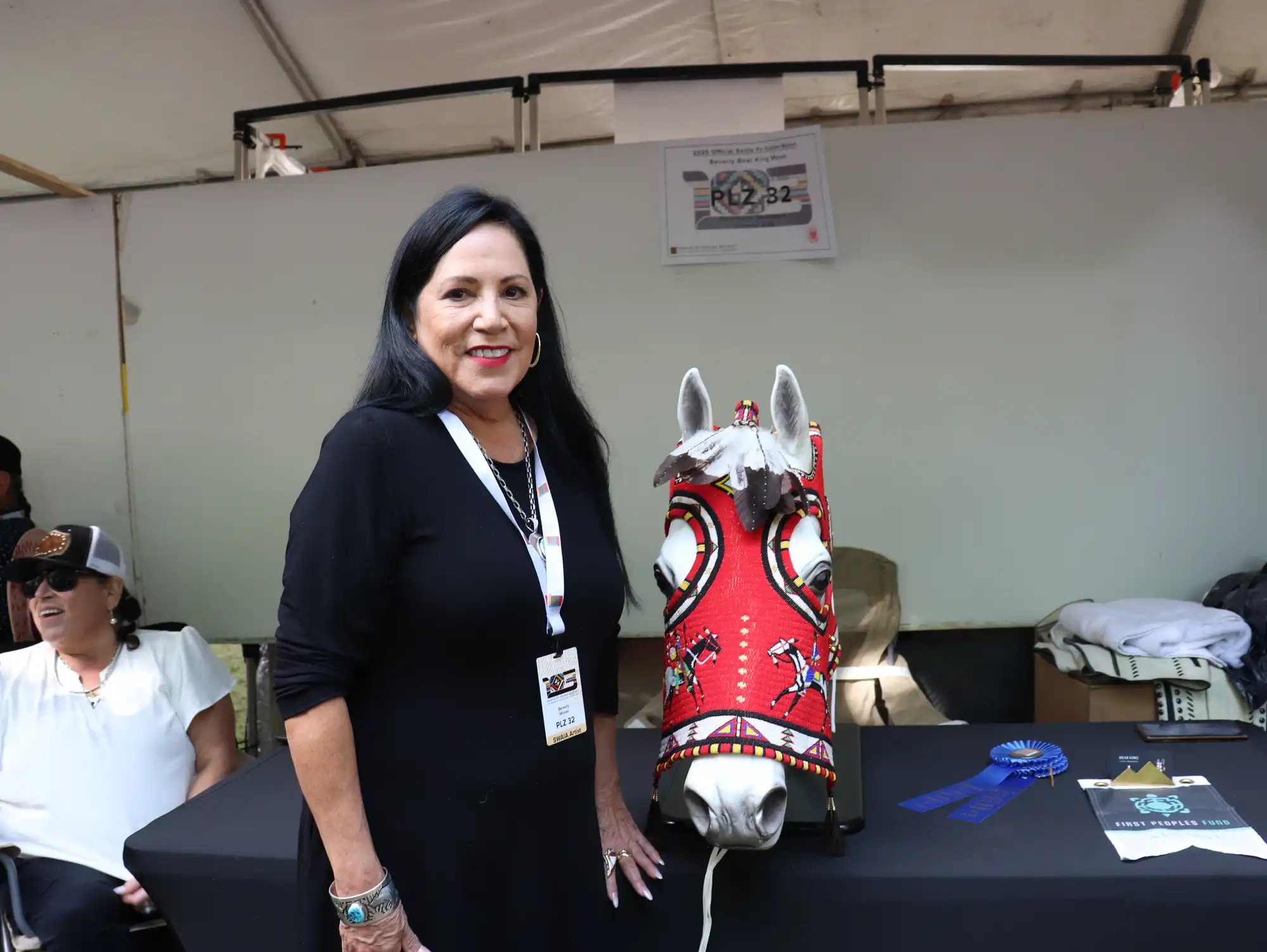 Bear King Moran poses with her horse mask.