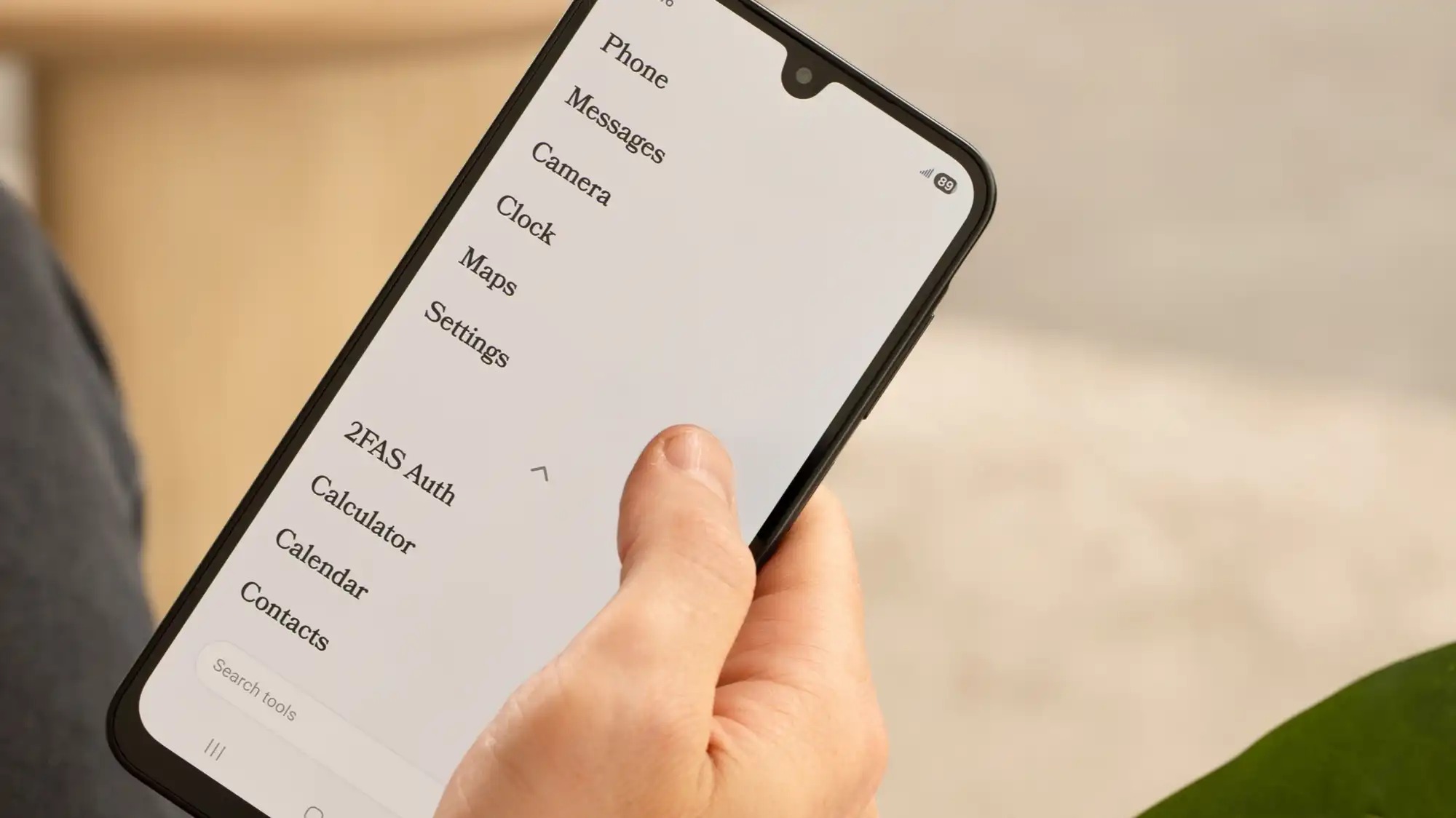 A black and white phone screen shows some basic options.