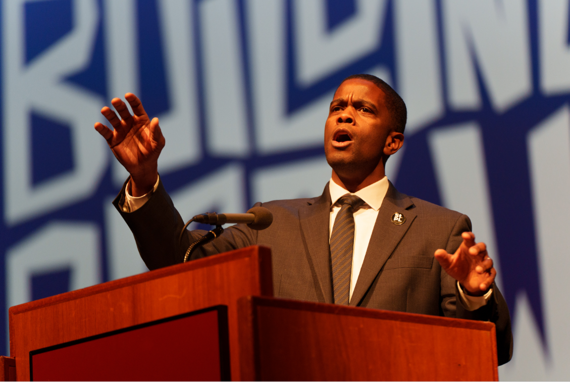 a man speaking at a podium